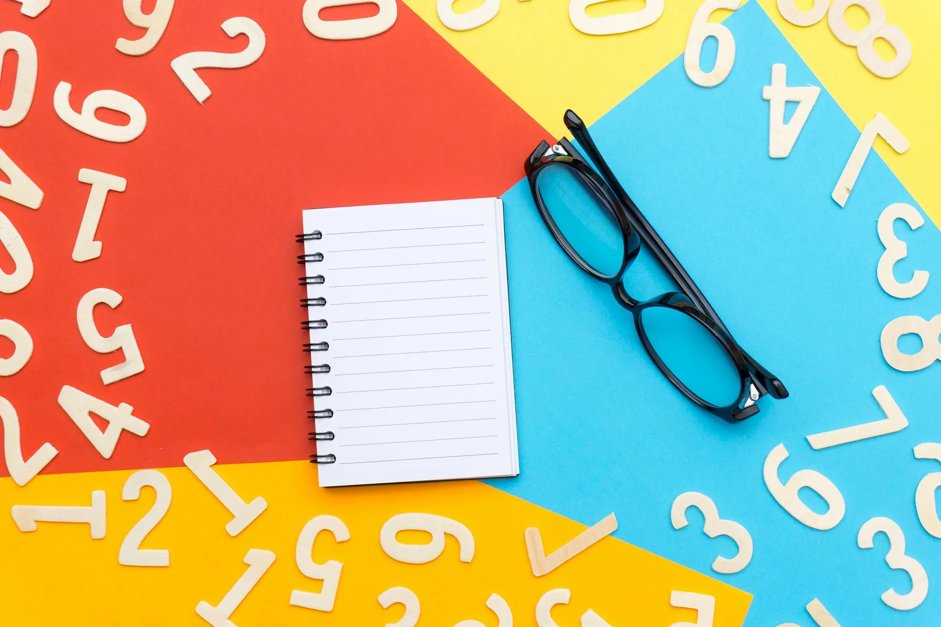 Ui/UX Design black framed eyeglasses beside notebook